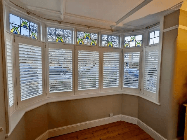 Café-style shutters screening the lower window