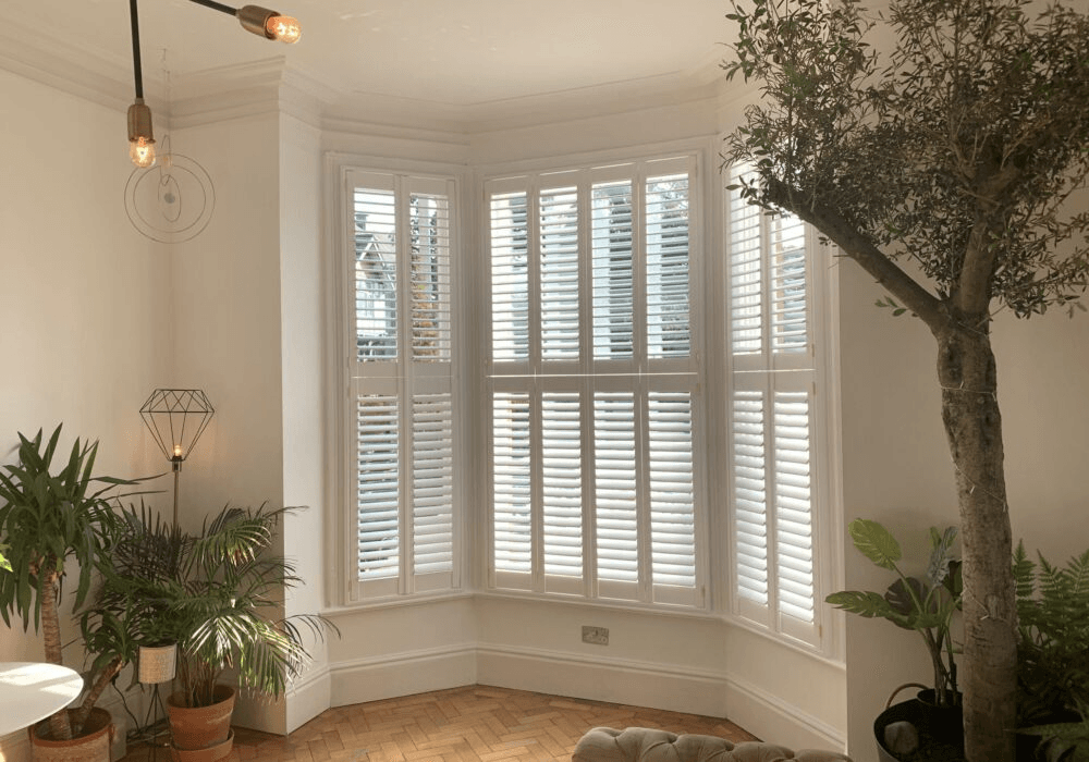 Tier-on-tier shutters with separate upper and lower panels