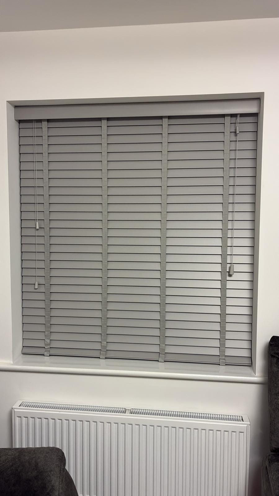 Wooden Venetian blinds fitted to a window